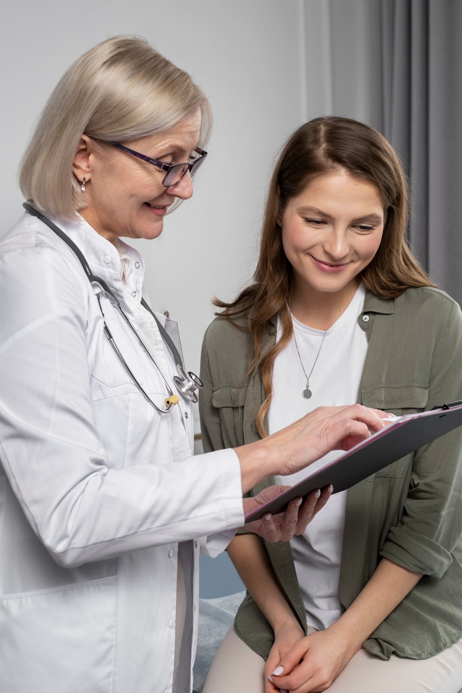 smiley-doctor-patient-chatting-medium-shot